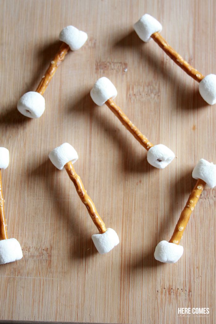Chocolate covered pretzel and marshmallow bones recipe. An easy and spooky treat!