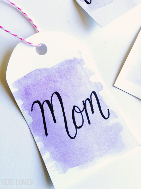 Hand lettered watercolor gift tags are the perfect touch for any gift. Learn how to make them with this easy tutorial at herecomesthesunblog.net