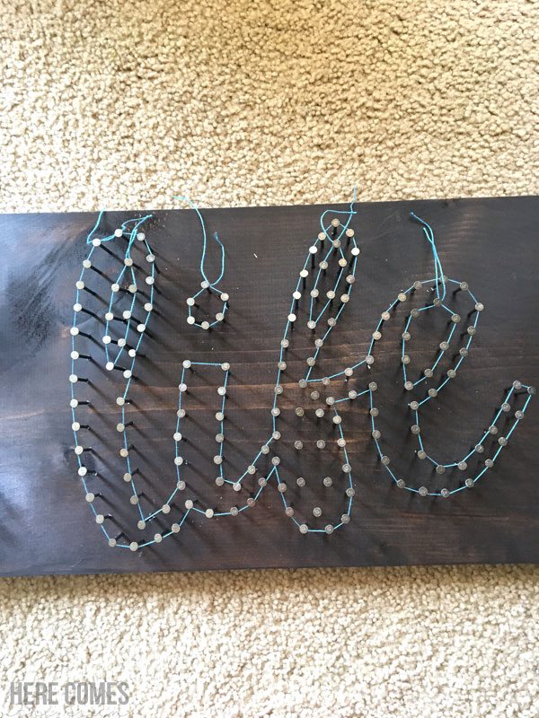 Script string art is easy to create and makes a great statement piece!