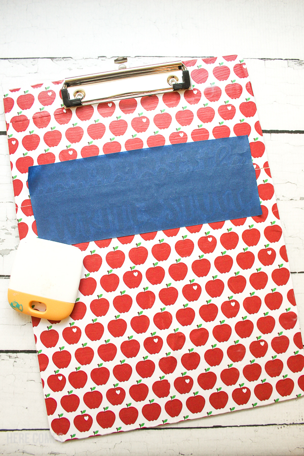 clipboard teacher gift decorated with scrapbook paper and vinyl