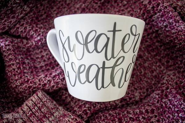 hand lettered fall mug on sweater background